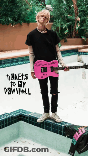 A Man Is Holding A Pink Guitar In Front Of A Pool With The Words Tickets To My Downfall On The Bottom GIF