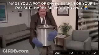 A Man Is Holding A Pot Of Cholo Beans In His Hands . GIF