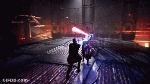 A Man Is Holding A Red Light Saber While Another Man Is Holding A Blue Light Saber GIF