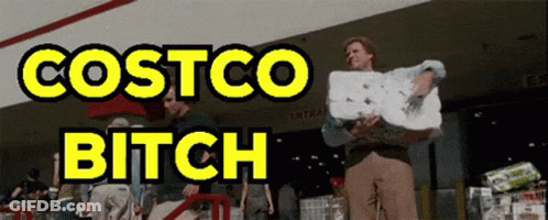 A Man Is Holding A Roll Of Paper Towels In Front Of Costco GIF