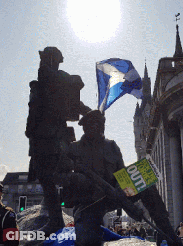 A Man Is Holding A Sign That Says " Out " GIF