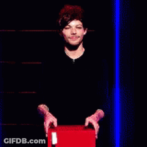A Man Is Holding A Sign That Says Safe In Front Of Him . GIF