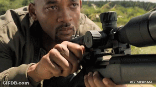 A Man Is Holding A Sniper Rifle With A #Geminiman Watermark GIF