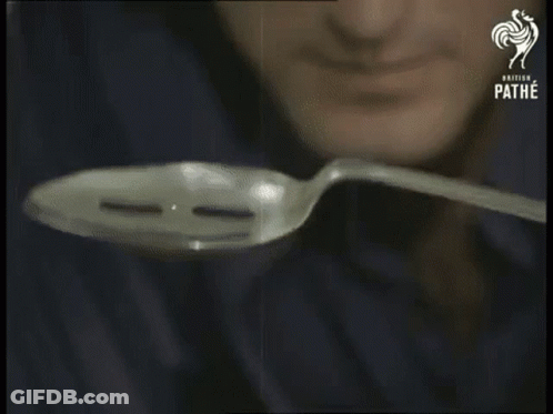 A Man Is Holding A Spoon In Front Of His Face And The Words Focus Are Visible GIF
