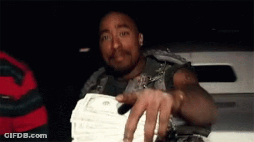 A Man Is Holding A Stack Of Money In His Hand While Sitting In A Car . GIF