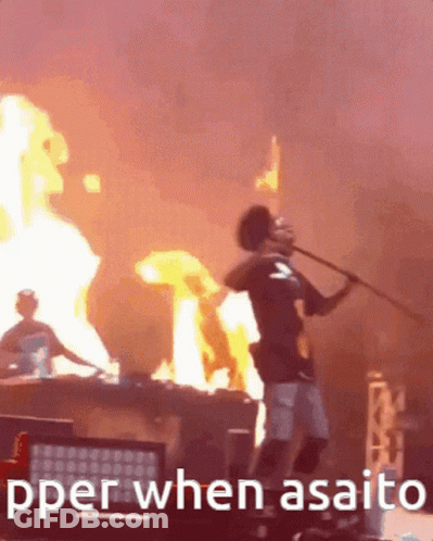 A Man Is Holding A Stick In Front Of A Fire With The Words " Pper When Asaito " Written Below Him GIF
