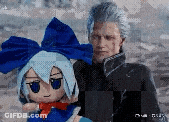 A Man Is Holding A Stuffed Doll With Blue Hair And A Bow . GIF