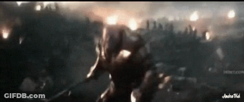 A Man Is Holding A Sword In Front Of A Crowd Of People And The Words Andrevid Are On The Bottom GIF