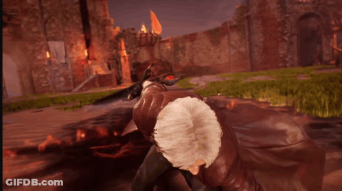 A Man Is Holding A Sword That Is Surrounded By Fire GIF
