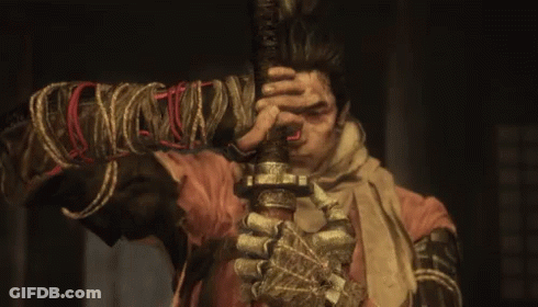 A Man Is Holding A Sword With A Rope Around His Wrist GIF