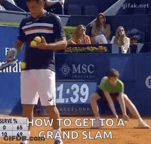 A Man Is Holding A Tennis Ball In His Hand While Another Man Watches . GIF