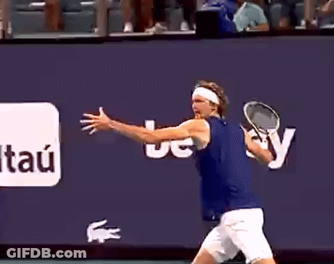 A Man Is Holding A Tennis Racquet In Front Of A Wall That Says Itau GIF