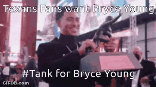 A Man Is Holding A Trophy In Front Of A Crowd And Says Texans Fans Want Bryce Young GIF