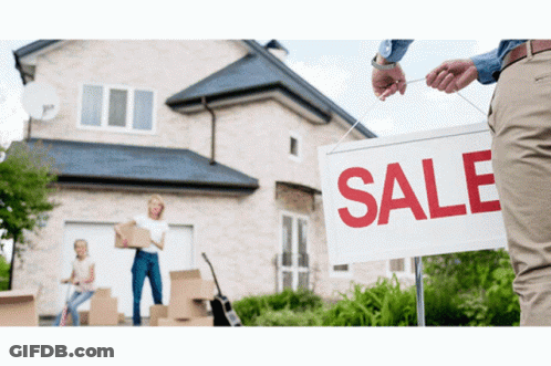 A Man Is Holding A White Sign That Says Sale GIF