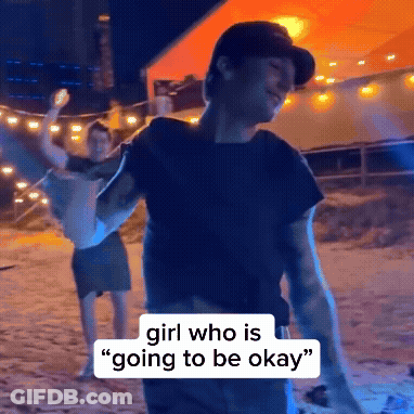 A Man Is Holding A Woman In His Arms And Says " Girl Who Is Going To Be Okay " On The Bottom GIF