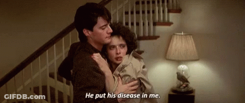 A Man Is Holding A Woman In His Arms And Says `` He Put His Disease In Me . '' GIF