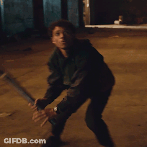 Man Holding Wooden Stick Back Up GIF
