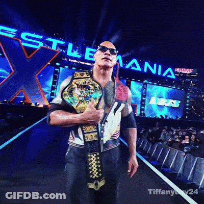 A Man Is Holding A Wrestling Championship Belt In Front Of A Sign That Says ' Wrestling ' GIF