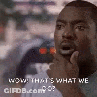 A Man Is Holding His Hand To His Chin And Making A Surprised Face . GIF