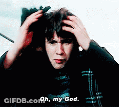 A Man Is Holding His Head While Saying Oh My God GIF