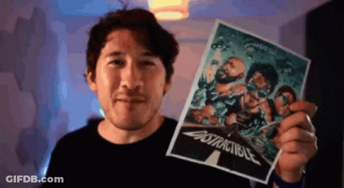 A Man Is Holding Up A Poster That Says " Distractable " On It GIF