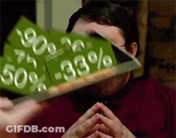 A Man Is Holding Up A Sign That Says 50 % -33 % GIF
