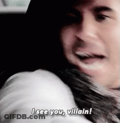 A Man Is Hugging A Woman And Saying I See You , Villain ! GIF