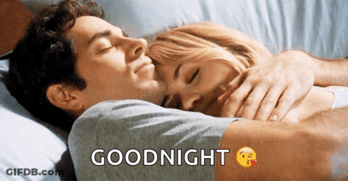 A Man Is Hugging A Woman In Bed With The Words Goodnight Written Above Them GIF
