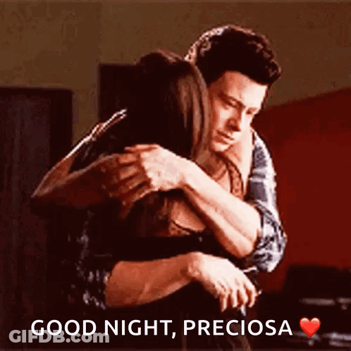 A Man Is Hugging A Woman With The Words " Good Night Preciosa " Written On The Bottom GIF