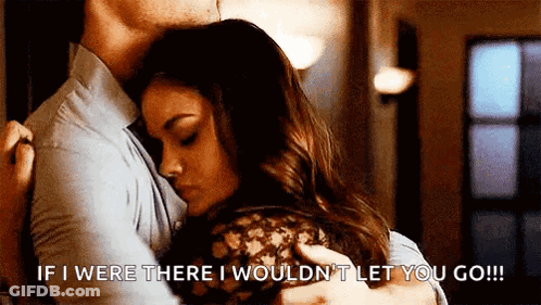 A Man Is Hugging A Woman With The Words `` If I Were There I Wouldn 'T Let You Go '' GIF