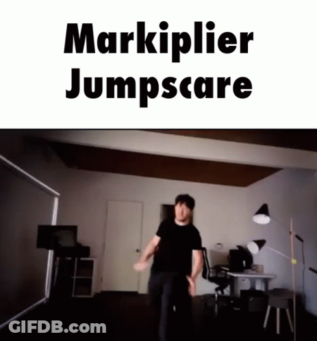 A Man Is Jumping In A Room With The Words Markiplier Jumpscare GIF