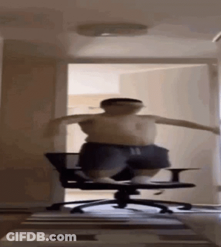A Man Is Jumping In The Air While Sitting On A Chair . GIF