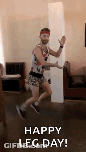 A Man Is Jumping In The Air With The Words `` Happy Leg Day ! '' GIF