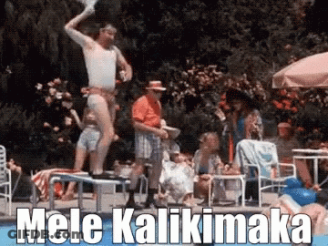 A Man Is Jumping Into A Swimming Pool With The Words Mele Kalikimaka Behind Him GIF
