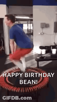 A Man Is Jumping On A Trampoline In A Gym With The Words `` Happy Birthday Bean '' . GIF