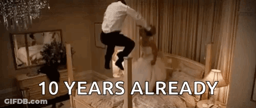 A Man Is Jumping On Top Of A Bed With A Bride . GIF