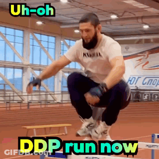 A Man Is Jumping Over A Hurdle With The Words " Ddp Run Now " Above Him GIF