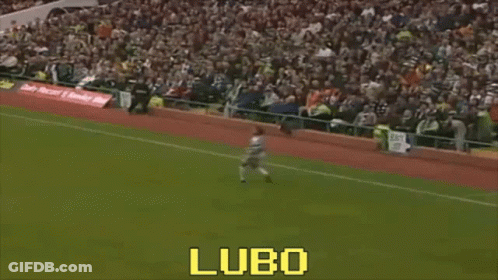 A Man Is Kicking A Soccer Ball On A Field With The Word Lubo On The Bottom Right GIF