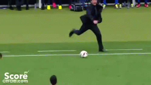 A Man Is Kicking A Soccer Ball On A Field With The Word Score On The Bottom Left GIF
