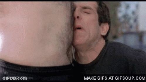 A Man Is Kissing Another Man 'S Stomach In A Movie Scene . GIF