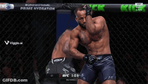 A Man Is Kneeling Down In A Cage With The Time Of 0:59 On The Screen GIF
