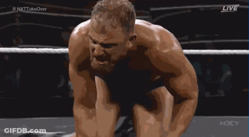 A Man Is Kneeling Down In A Wrestling Ring With The Words Live On The Bottom Right GIF