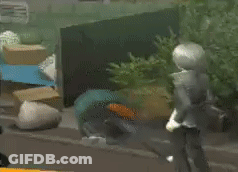 A Man Is Kneeling Down In Front Of A Bunch Of Boxes GIF