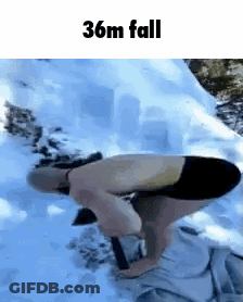 A Man Is Kneeling Down In The Snow With A Shovel And The Words 36M Fall Above Him . GIF