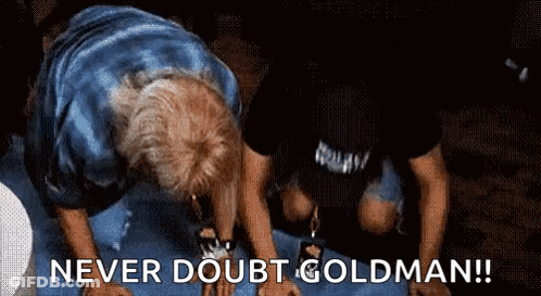 A Man Is Kneeling Down With The Words Never Doubt Goldman Written On The Bottom GIF