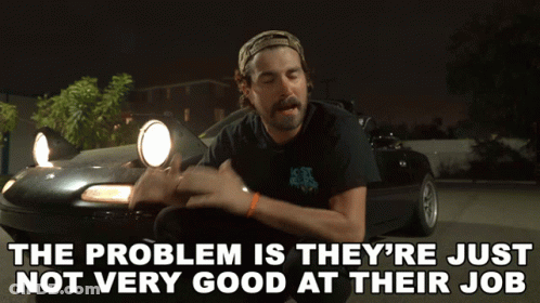 A Man Is Kneeling In Front Of A Car With The Words The Problem Is They 'Re Just Not Very Good GIF