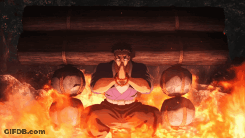 A Man Is Kneeling In Front Of A Fire With His Hands Folded GIF