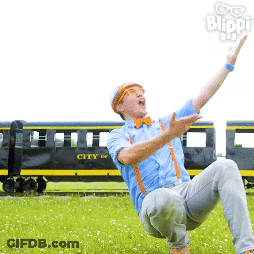 A Man Is Kneeling In Front Of A Train That Says City On It GIF