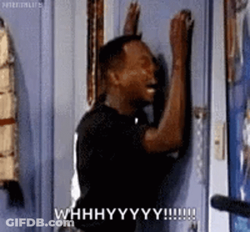 A Man Is Knocking On A Door And Making A Funny Face With His Hands . GIF