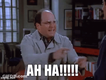 A Man Is Laughing And Pointing At Another Man With The Words Ah Ha !!! On His Face . GIF
